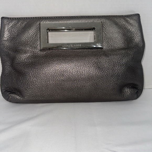 Michael Kors Handbags - Michael Kors Silver Hand Cluch Purse Women's
